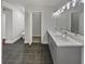 Bathroom with a double vanity and walk-in closet at 2548 Loghaven Nw Dr, Atlanta, GA 30318