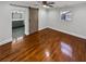 Bedroom with hardwood floors and a barn door leading to the bathroom at 2548 Loghaven Nw Dr, Atlanta, GA 30318