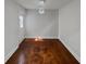 Empty dining room featuring hardwood floors and a decorative chandelier at 2548 Loghaven Nw Dr, Atlanta, GA 30318
