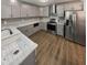 Modern kitchen with stainless steel appliances, granite countertops, and gray cabinetry at 2548 Loghaven Nw Dr, Atlanta, GA 30318