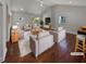 Bright living room with vaulted ceilings, a white brick fireplace, and modern decor at 2548 Loghaven Nw Dr, Atlanta, GA 30318