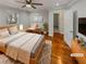 Inviting main bedroom featuring hardwood floors and a large window at 2548 Loghaven Nw Dr, Atlanta, GA 30318