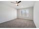 Comfortable bedroom featuring a ceiling fan, neutral walls, and soft carpeting at 613 Woodstone Rd, Lithonia, GA 30058