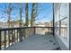 Wooden deck with gray railing, overlooking the backyard at 613 Woodstone Rd, Lithonia, GA 30058