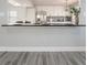 Close up of modern kitchen with stainless steel appliances and bar height seating at 613 Woodstone Rd, Lithonia, GA 30058