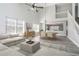 Bright open living room and dining area featuring high ceilings and abundant natural light at 613 Woodstone Rd, Lithonia, GA 30058