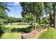 View of golf course with beautiful landscaping and trees at 8480 St Marlo Fairway, Duluth, GA 30097