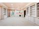 Finished basement featuring custom built-in shelving, cabinets, and desk space at 8480 St Marlo Fairway, Duluth, GA 30097