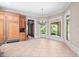 Bright breakfast nook with large windows and elegant chandelier lighting fixture at 8480 St Marlo Fairway, Duluth, GA 30097