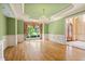 Elegant dining room with large windows, chandelier, and doorway entrance at 8480 St Marlo Fairway, Duluth, GA 30097