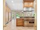 Gourmet kitchen with stainless steel appliances, custom cabinets, and large island at 8480 St Marlo Fairway, Duluth, GA 30097