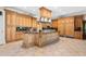 Gourmet kitchen with custom wood cabinetry, a large island, and top-of-the-line stainless steel appliances at 8480 St Marlo Fairway, Duluth, GA 30097