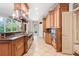 Spacious kitchen with stainless steel appliances, custom cabinets, and granite countertops at 8480 St Marlo Fairway, Duluth, GA 30097