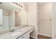 Bathroom featuring granite countertops, a large mirror, and white cabinets at 132 Prity Ct, Mcdonough, GA 30253