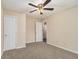 A cozy bedroom featuring neutral walls, plush carpet, and a stylish ceiling fan with lighting at 132 Prity Ct, Mcdonough, GA 30253