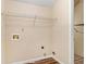 Laundry room equipped with shelving and washer and dryer hook-ups at 132 Prity Ct, Mcdonough, GA 30253