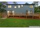 Expansive backyard featuring a spacious wooden deck and lush green lawn, perfect for outdoor entertaining at 1400 Bouldercrest Rd, Atlanta, GA 30316