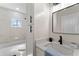 Bathroom showcasing tile walls, a tub, and vanity at 1400 Bouldercrest Rd, Atlanta, GA 30316
