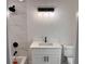 Modern bathroom featuring white marble tile shower, vanity with white countertop, and black fixtures at 1400 Bouldercrest Rd, Atlanta, GA 30316