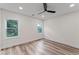 Bright bedroom features wood floor, a ceiling fan, and dual windows at 1400 Bouldercrest Rd, Atlanta, GA 30316