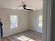 Bright bedroom with stylish flooring, a ceiling fan, and natural light from large windows at 1400 Bouldercrest Rd, Atlanta, GA 30316