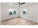 Bedroom with wood-look floors, ceiling fan, and natural light creating a cozy atmosphere at 1400 Bouldercrest Rd, Atlanta, GA 30316