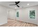 Bright bedroom features wood floor, ceiling fan, and dual windows at 1400 Bouldercrest Rd, Atlanta, GA 30316