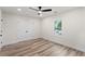 Bright bedroom features wood floor, ceiling fan, and a double-door closet at 1400 Bouldercrest Rd, Atlanta, GA 30316