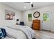 Cozy bedroom with natural light, neutral walls, a modern ceiling fan, and hardwood floors at 1400 Bouldercrest Rd, Atlanta, GA 30316