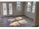 Sunlit bedroom with windows overlooking the neighborhood, with new flooring and fresh paint at 1400 Bouldercrest Rd, Atlanta, GA 30316