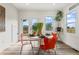 Breakfast nook with orange chairs and view to deck at 1400 Bouldercrest Rd, Atlanta, GA 30316