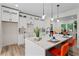 Kitchen featuring white cabinets, an island with seating, and modern pendant lights at 1400 Bouldercrest Rd, Atlanta, GA 30316