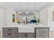 Kitchen with white cabinets, large island, and stainless steel dishwasher at 1400 Bouldercrest Rd, Atlanta, GA 30316