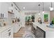 Eat-in kitchen featuring white cabinets, stainless steel appliances, and wood floors at 1400 Bouldercrest Rd, Atlanta, GA 30316