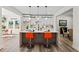 Bright, open kitchen with white cabinets, a gray island, and orange bar stools at 1400 Bouldercrest Rd, Atlanta, GA 30316