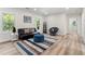 Cozy living room with wood-look floors, futon, and stylish accents, perfect for relaxation at 1400 Bouldercrest Rd, Atlanta, GA 30316
