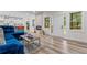 Open-concept living area with modern finishes, an electric fireplace, and seamless flow to kitchen at 1400 Bouldercrest Rd, Atlanta, GA 30316
