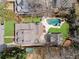 Expansive backyard featuring a pool, hot tub, and manicured lawn in a beautiful neighborhood at 1518 Cambridge Ave, Atlanta, GA 30337