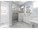Spa-like bathroom boasts marble surfaces, a large glass shower, and double vanities at 1518 Cambridge Ave, Atlanta, GA 30337