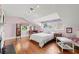 Light-filled bedroom features wood floors, a window seat, and a quaint vanity area at 1518 Cambridge Ave, Atlanta, GA 30337
