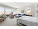 Spacious bedroom with lots of natural light, carpeted floors, and ample seating area at 1518 Cambridge Ave, Atlanta, GA 30337