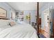 Comfortable bedroom with a four-poster bed, hardwood floors, and bright natural light at 1518 Cambridge Ave, Atlanta, GA 30337