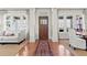 Bright entryway featuring hardwood floors, a decorative rug, and views into the living and dining areas at 1518 Cambridge Ave, Atlanta, GA 30337