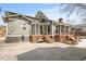 Exterior view showing home's rear decks, stairs, and backyard at 1518 Cambridge Ave, Atlanta, GA 30337
