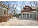 Exterior view of home featuring backyard, two-car garage, and inground pool at 1518 Cambridge Ave, Atlanta, GA 30337