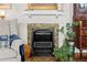 Close-up of a charming fireplace with decorative tilework and classic details at 1518 Cambridge Ave, Atlanta, GA 30337