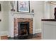 Fireplace with tile surround and black mantel at 1518 Cambridge Ave, Atlanta, GA 30337