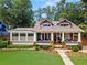 Charming craftsman home with a welcoming front porch, well-maintained landscaping, and inviting curb appeal at 1518 Cambridge Ave, Atlanta, GA 30337