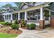 Inviting home with a covered porch, white columns and beautifully landscaped yard at 1518 Cambridge Ave, Atlanta, GA 30337