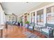 Charming front porch with hardwood floors, comfortable seating, and views of the neighborhood at 1518 Cambridge Ave, Atlanta, GA 30337